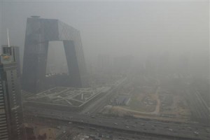 File photo of China Central Television building next to construction site in heavy haze in Beijing's central business district