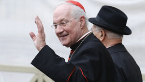Canadian Cardinal Marc Ouellet waves as he arrives for a meeting at at the Vatican on Thursday.