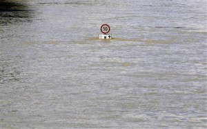A road sign is seen submerged in water in the flooding Danube River in Budapest