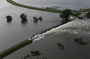 Picture shows broken dam built to contain swollen Elbe river during floods near village of Fischbeck