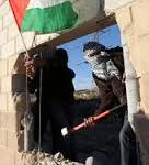 Palestinians break hole in wall