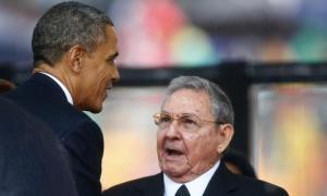 U.S. President Obama greets Cuban President Castro at the memorial service for Mandela in Johannesburg