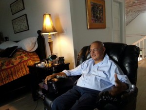 In this photo taken Saturday, March 2, 2013, Dr. Arthur Porter speaks with a reporter at his home in Nassau, Bahamas. Porter -- a cancer specialist who was facing fraud charges related to a $1.3-billion hospital project in Montreal -- has died, his biographer says. THE CANADIAN PRESS/AP/Jeff Todd