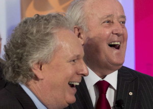 Former Prime Minister Brian Mulroney, right, arrives with former Quebec Premier Jean Charest at a tribute for Claude Ryan Friday, February 14, 2014 in Montreal.THE CANADIAN PRESS/Ryan Remiorz