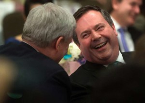 Prime Minister Stephen Harper, left, and Jason Kenney, Minister of Defence and Minister of Multiculturalism, share a laugh after entertainer and master of ceremonies Ardavan Mofid mistakenly called Kenney prime minister at a Canadian Iranian Foundation Nowruz event in Vancouver, B.C., on Saturday March 21, 2015. THE CANADIAN PRESS/Darryl Dyck
